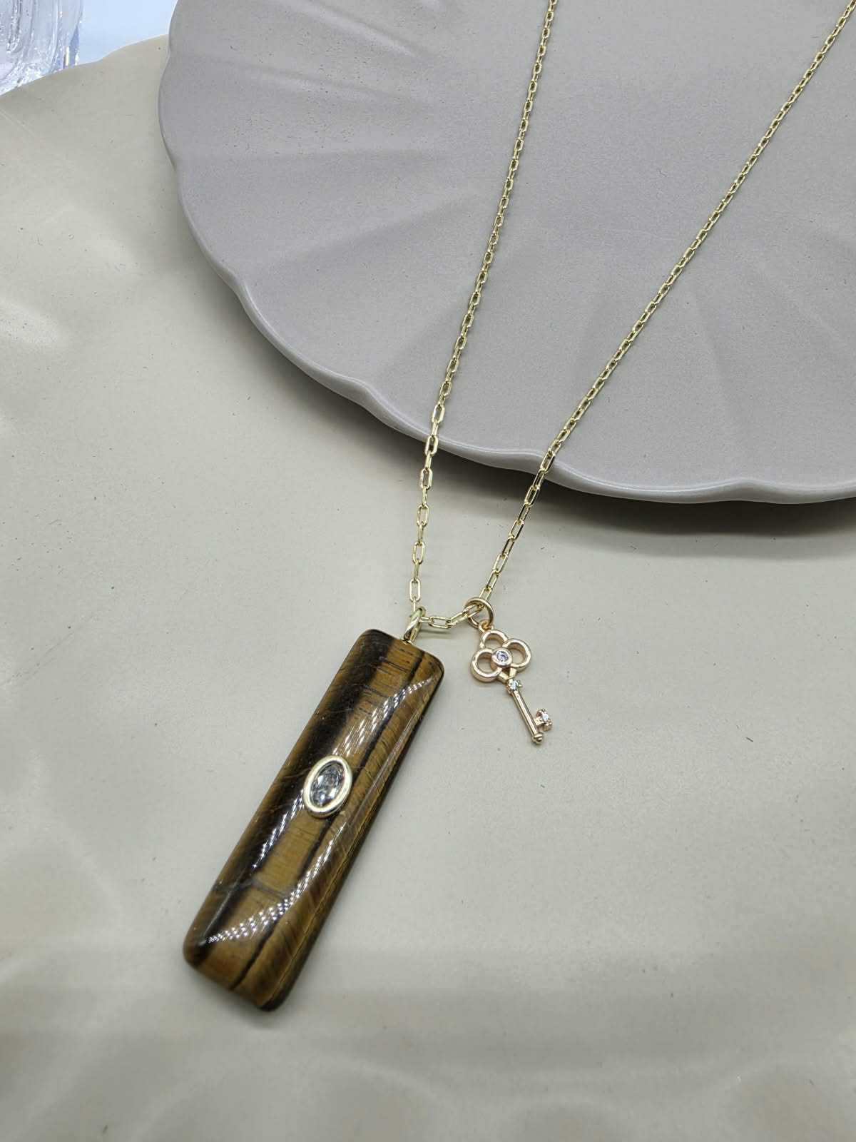 COLLAR DIJES BARRA OJO TIGRE