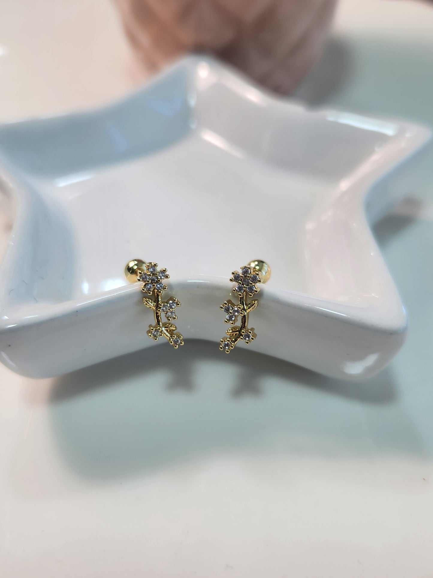 Broquel flor zirconia.