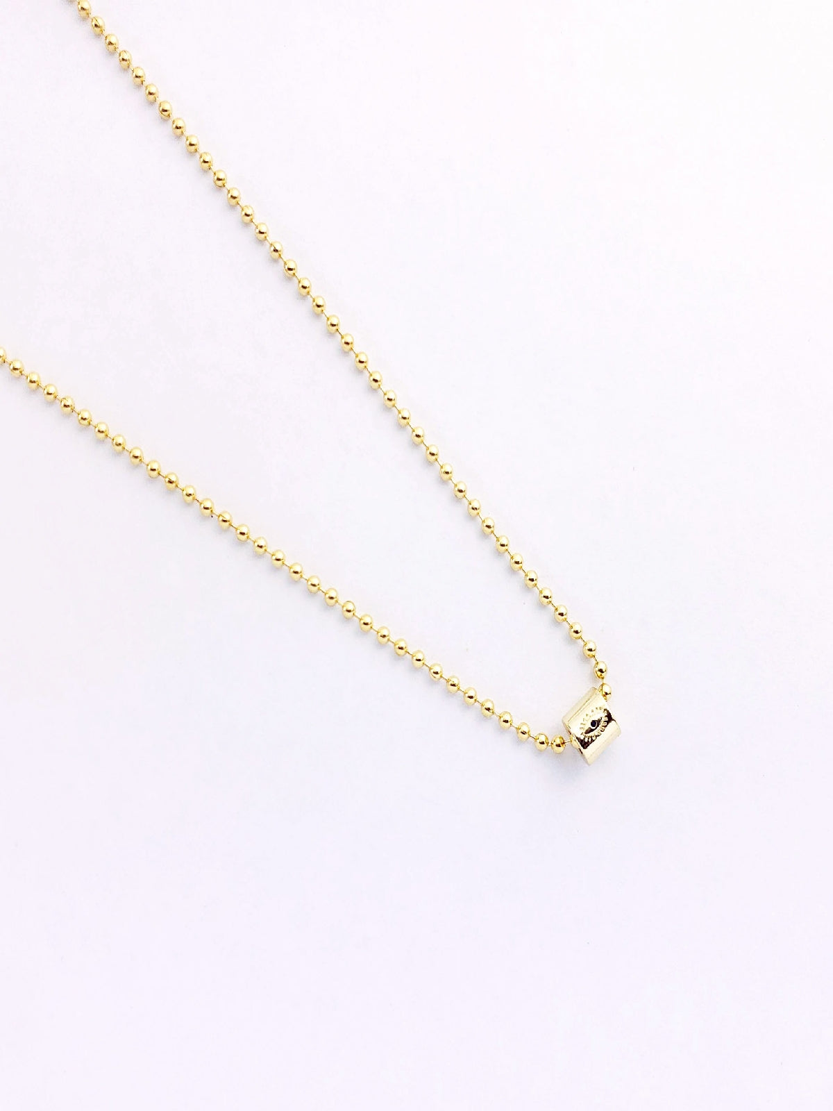 COLLAR PETITE BARRILITO MINI OJO EN CHAPA DE ORO