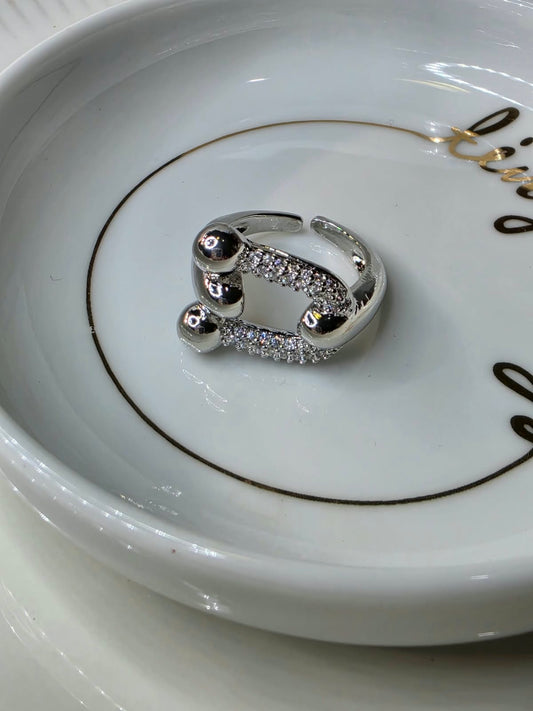 ANILLO RODIO HERRADURA ZIRCONIA