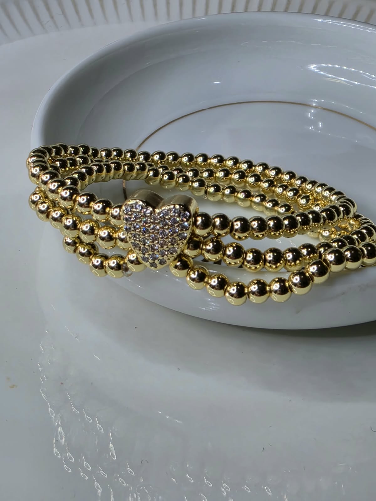 PULSO BOLAS CORAZON ZIRCONIA TRIPLE DORADA