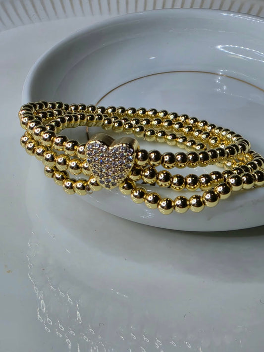 PULSO BOLAS CORAZON ZIRCONIA TRIPLE DORADA